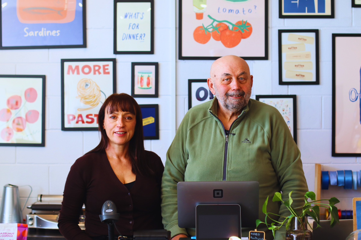 Man and woman at shop counter.