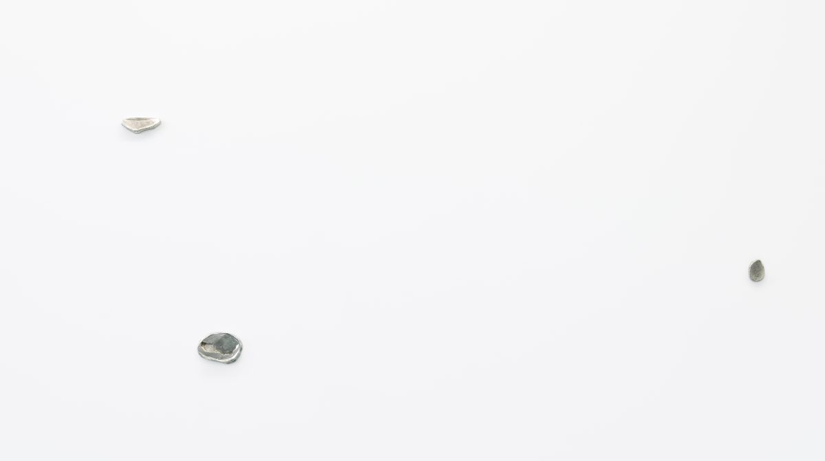 Sparse composition with metal bits on a wall