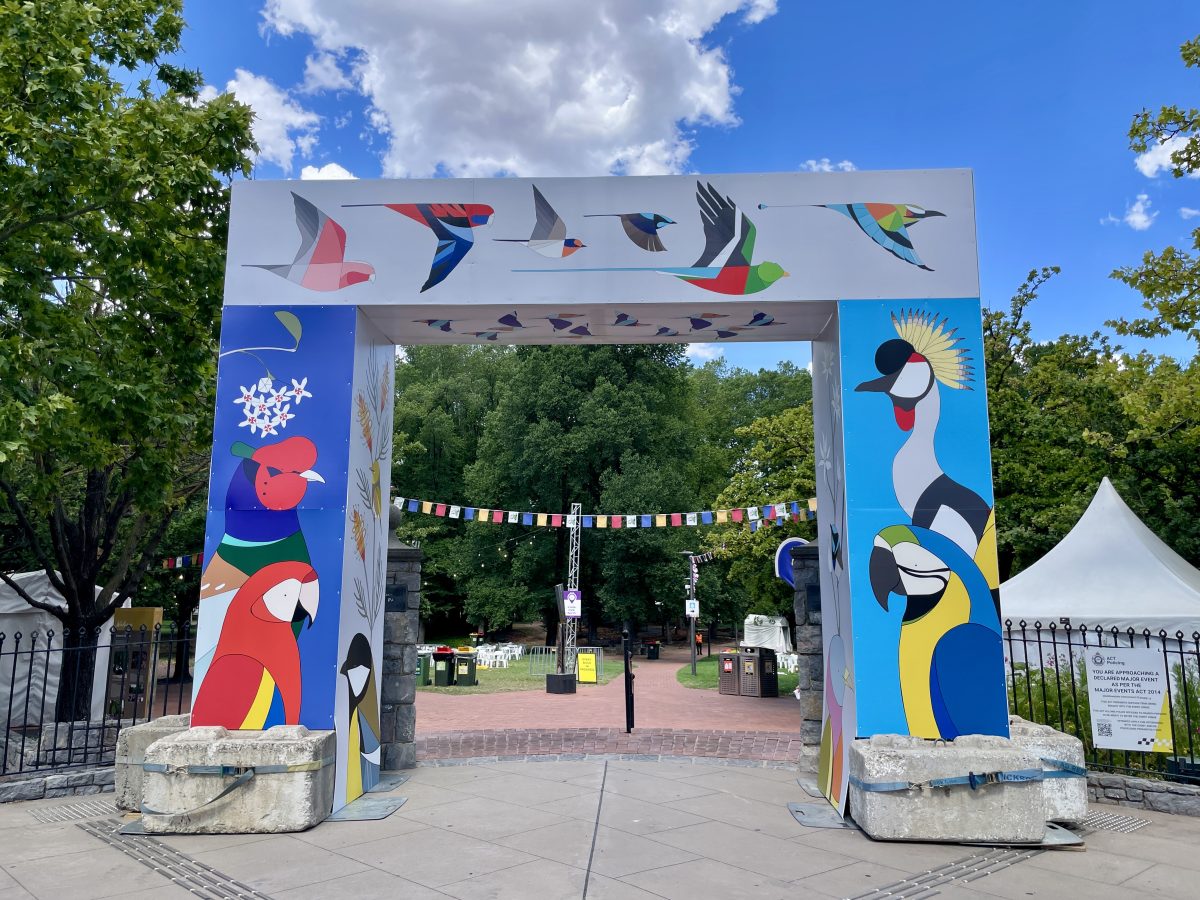 Archway covered in cartoon depictions of birds.
