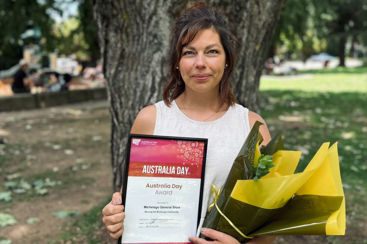 Woman holiday flowers and certificate.