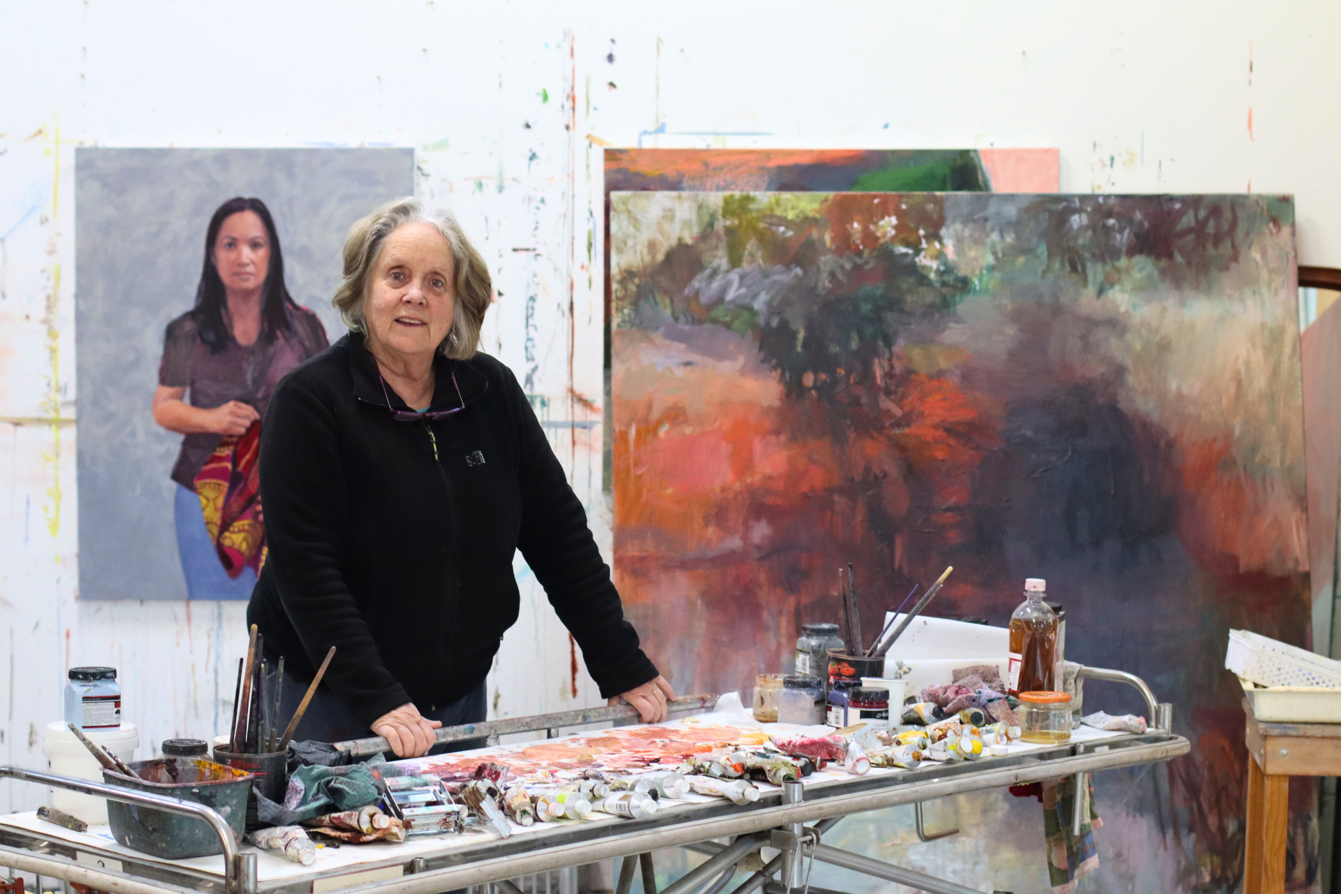 Woman stands in art studio